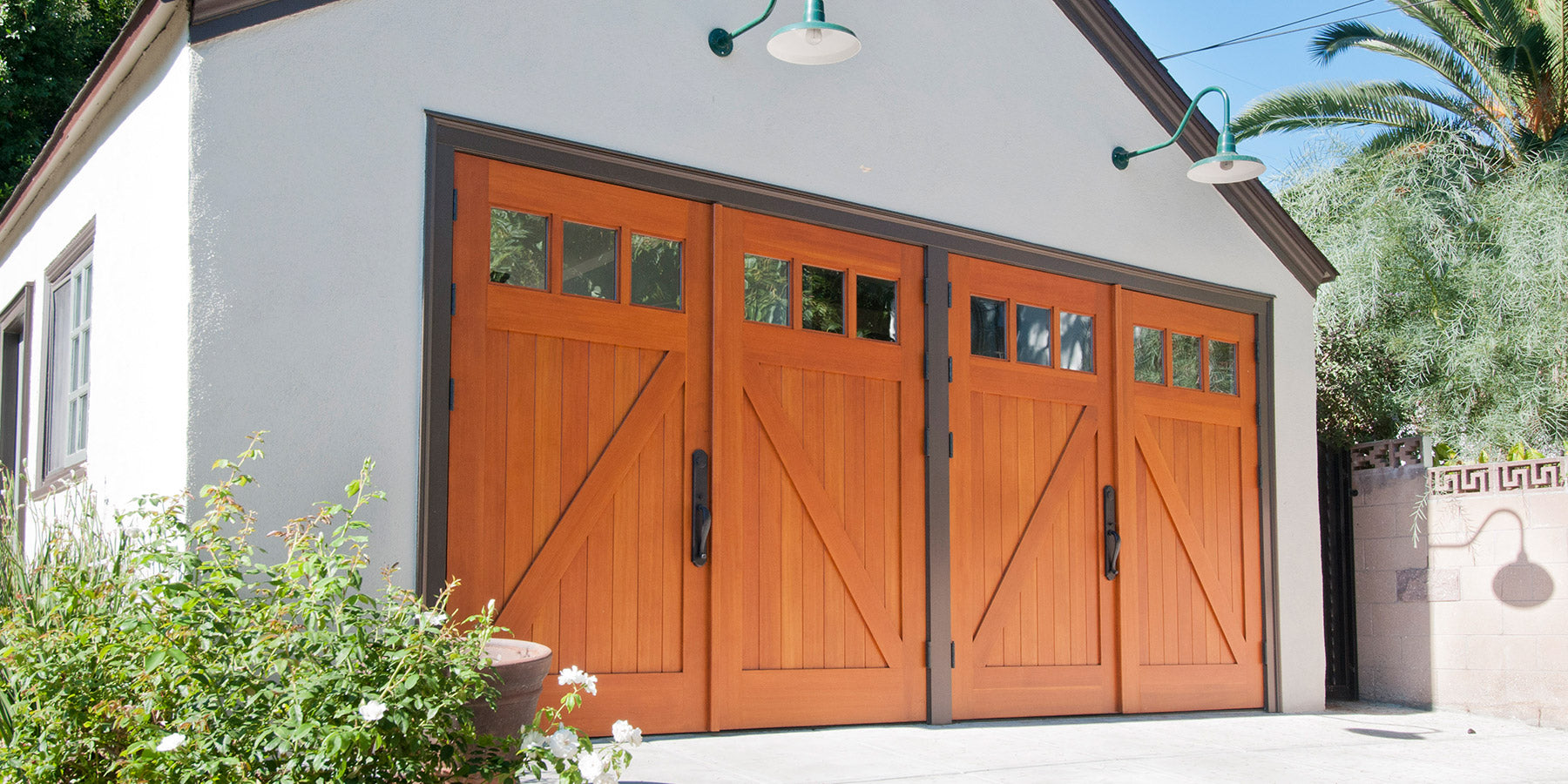 Pictures highlights a two sets of Z-Brace Carriage doors on a garage entrance. Photo by RealCraft.