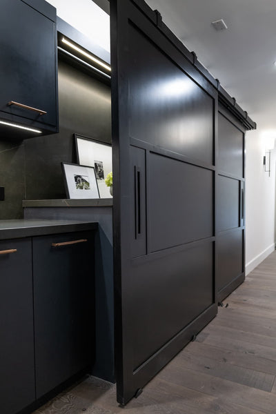 barn door closed over washer and dryer