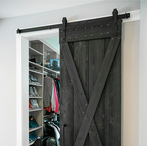 sliding barn door in use in a closet