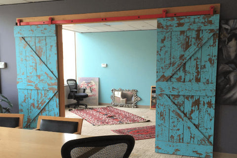 Bi Parting Barn Doors That Are Blue With A Rustic Grungy Finish Opening From A Conference Room To An Office