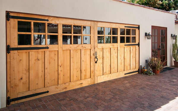 carriage doors with glass lights and strap hinges