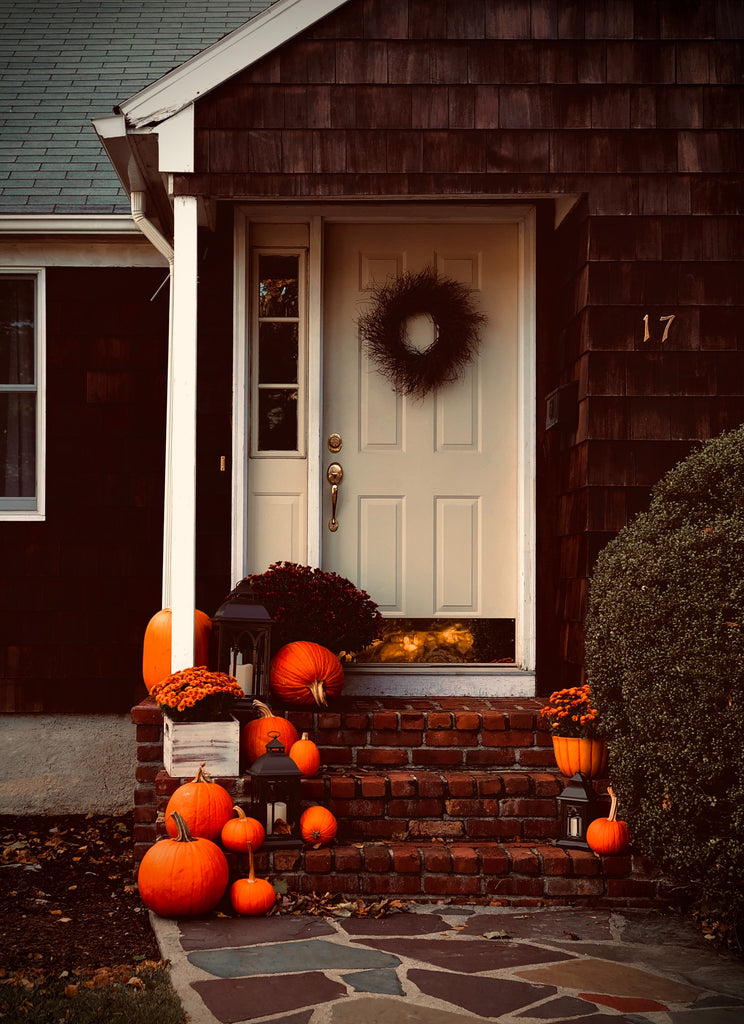 front door on traditional home with pumpkin and fall decor