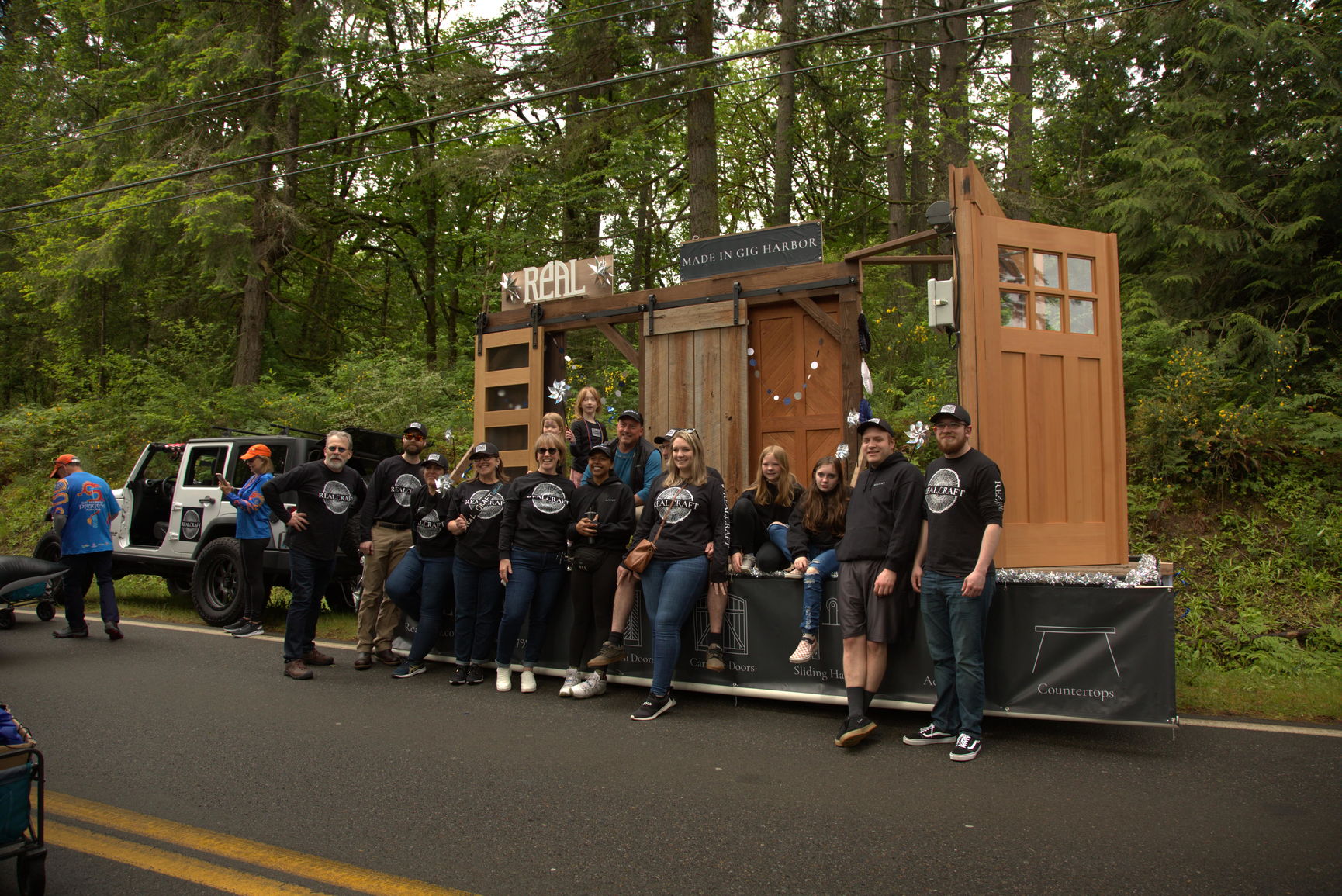 group photo of RealCraft Team with our parade float