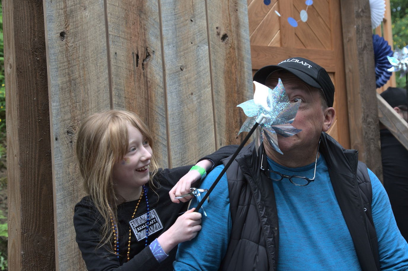 custom sales representative with a young parade float volunteer