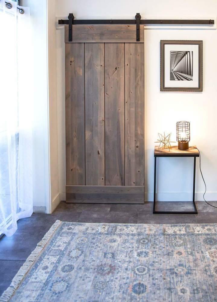 weathered barn door with side table and sliding hardware