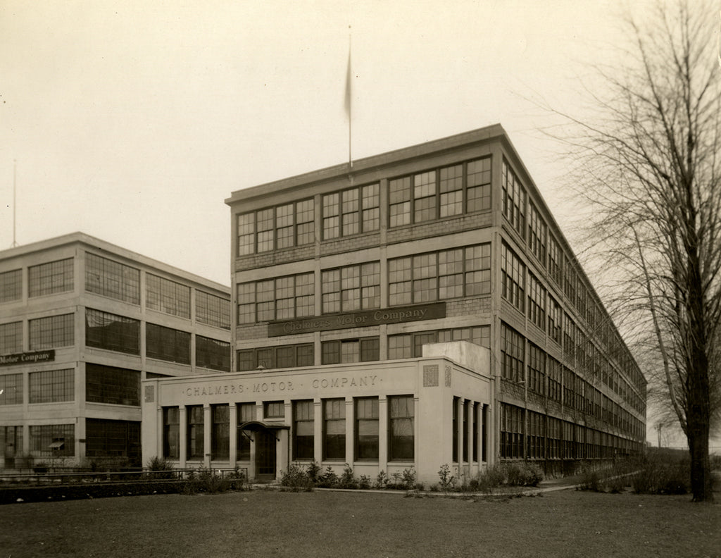 Historic photo of the Chalmers Motor Company building designed by Albert Kahn with Pewabic Tile features on the exterior entrance.