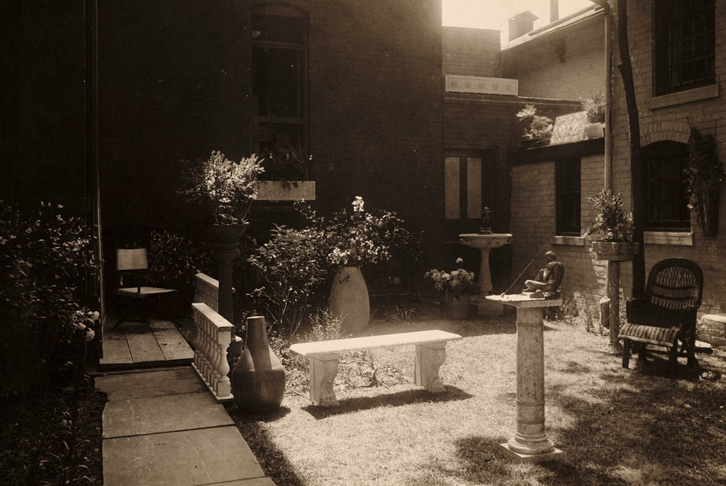 Sepia-toned photo of the lush Detroit Society of Arts & Crafts courtyard in the year 1912.