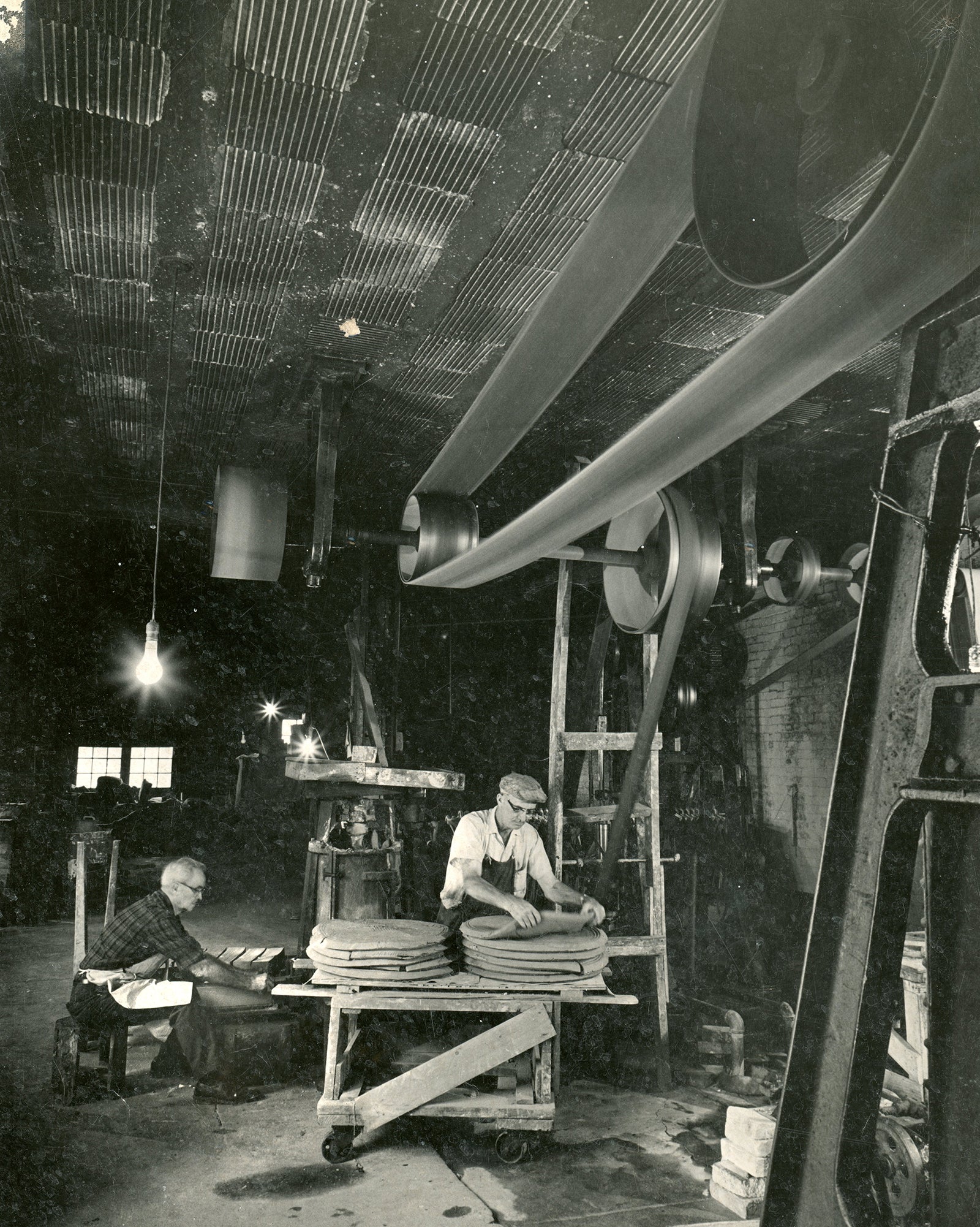 Former Pewabic employees Ira Peters and Primo Valoni circa 1950s-60s working on mixing clay.