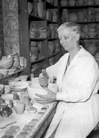 Mary Chase Perry Stratton mixing glaze ingrediants.