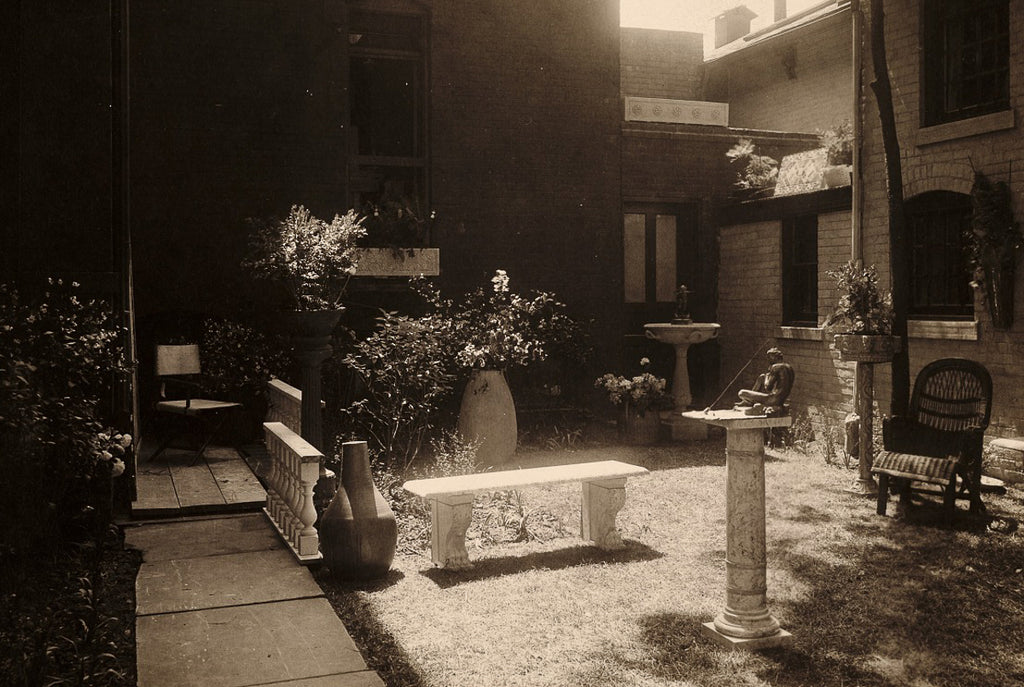 Sepia photo of the Detroit Arts and Crafts Society’s courtyard featuring Pewabic post circa 1912