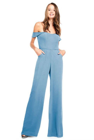 Model wearing Bari Jay's 2030 Jumpsuit in dusty blue