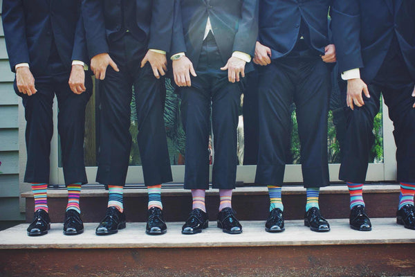 Fun groomsmen socks are an excellent way to bring some life to the standard suit and tie.