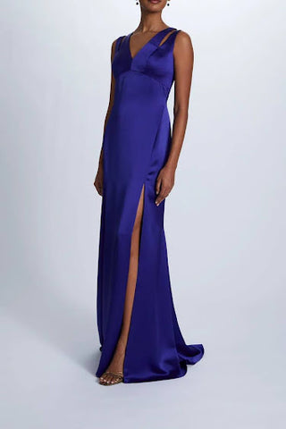 V-neck, empire waist gown. A column skirt with a slight train and a daring slit complete this cobalt blue dress!