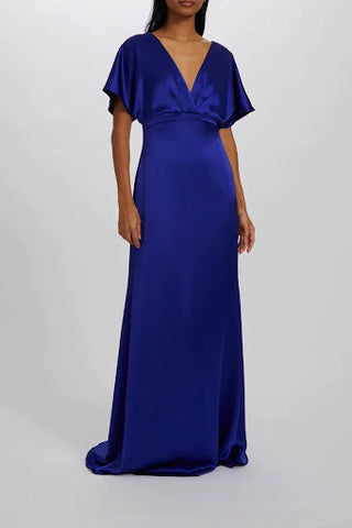 Full-length cobalt blue bridesmaid dress with v-neck and sleeves