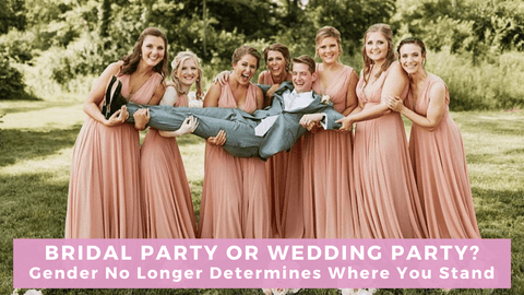 Seven bridesmaids in pink dresses holding up a man in a suit