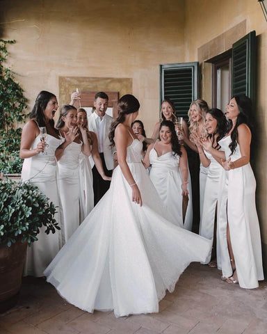 Bride and bridesmaids celebrating