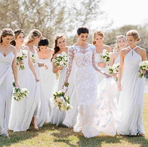 Bridesmaids wearing dresses with different details