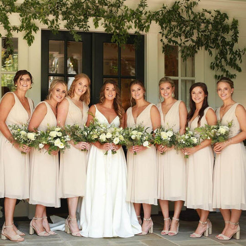 Bridesmaids in tan dresses