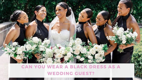 Dark haired bride (in white, of course) with her bridesmaids all in black dresses