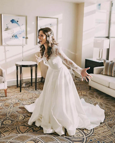 Bride smiling to an unseen person outside of the picture's frame