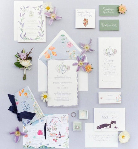 Wedding invitation suite in various shades of white and lavender