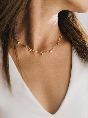 A dainty collar of freshwater pearls is an exquisite and elegant addition to any neckline.