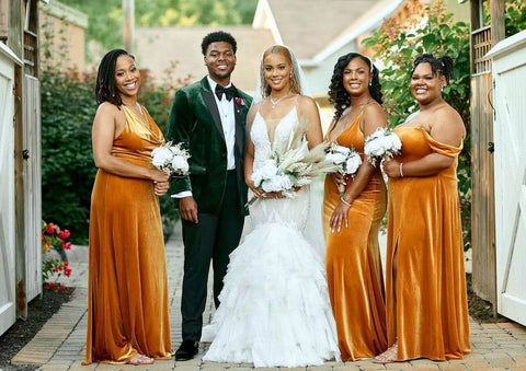 Bride and groom posing with bridesmaids