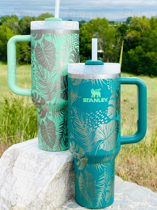 https://cdn.shopify.com/s/files/1/0115/1683/7945/files/abstract-tropical-custom-stanley-adventure-quencher-40-oz-tumbler-tumblers-350.jpg?v=1686695110&width=533