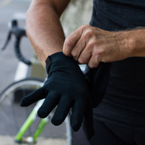 Man fitting a pair of gloves