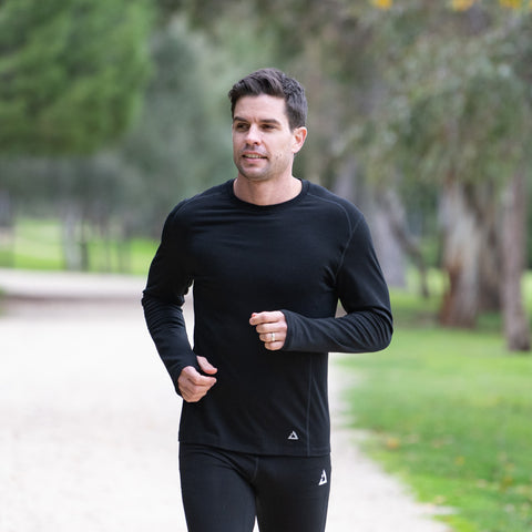 Man running wearing a long sleeve black top