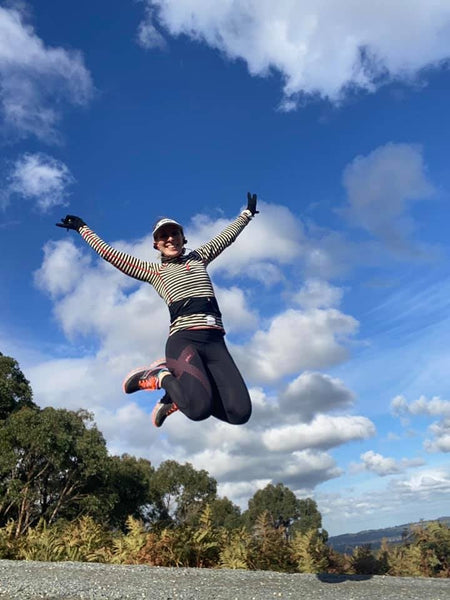 Woman jumping high in the air