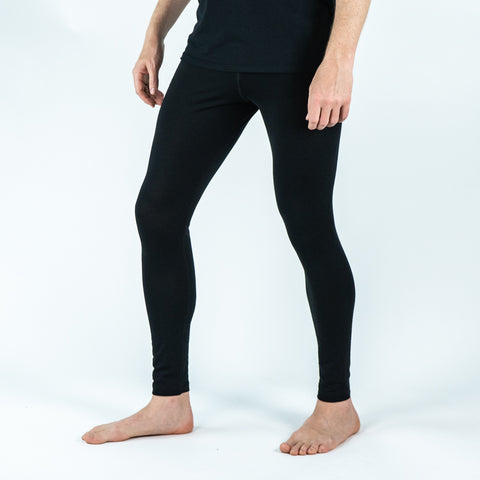 Model wearing ioMerino's Men's Altitude Tights - Ready for Adventure in Black