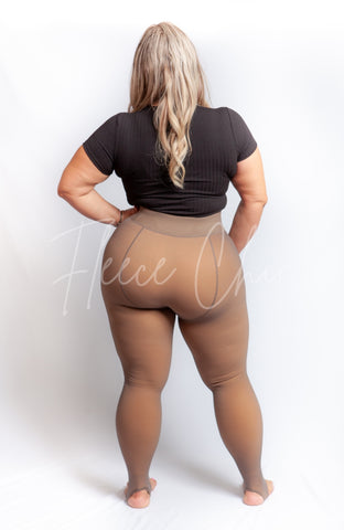 Opaque tights plus size that are in the Stirrup Style are worn by a larger model  - Fleece Chic