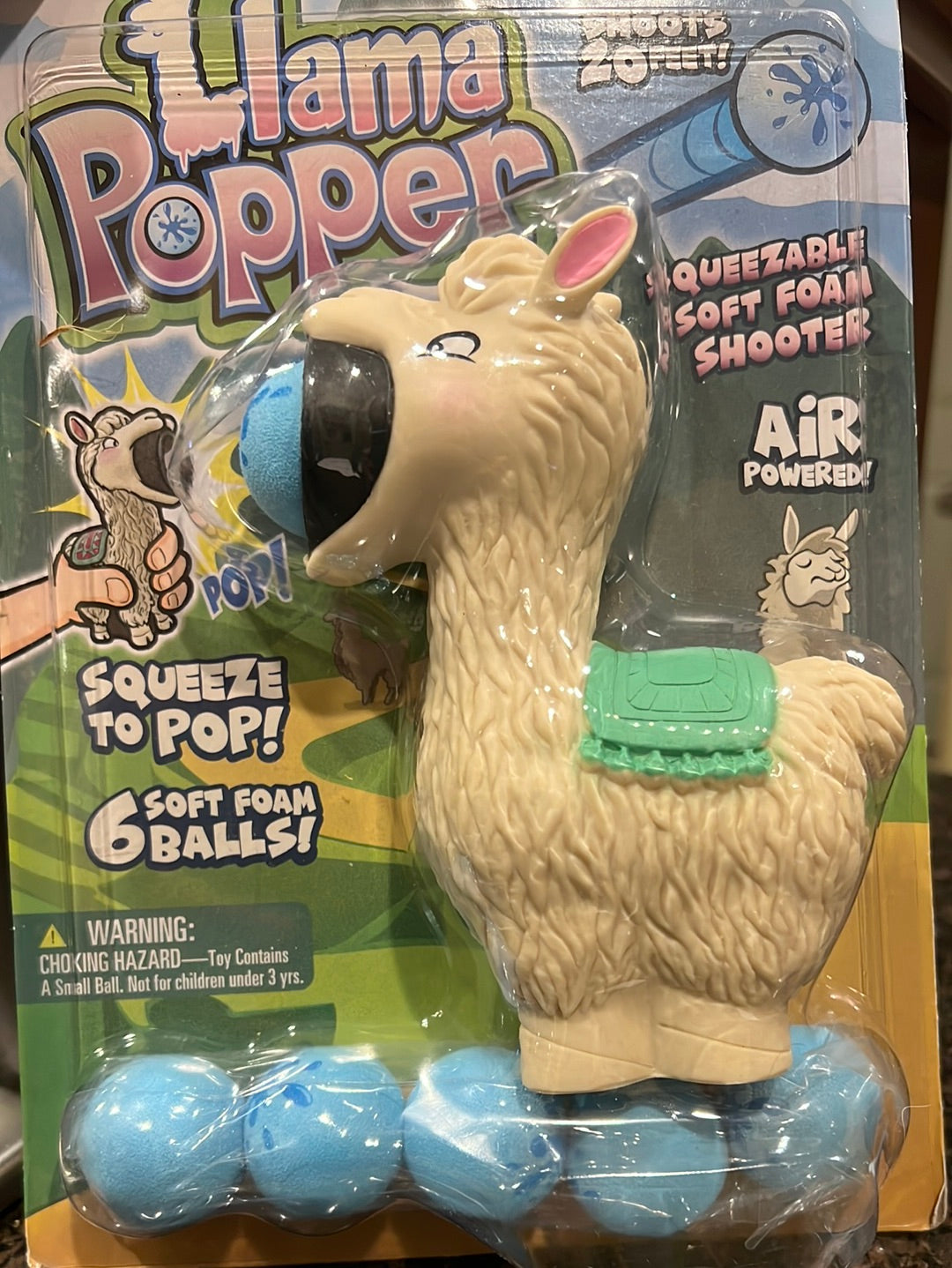 Llama Popper with pink ears and green blanket