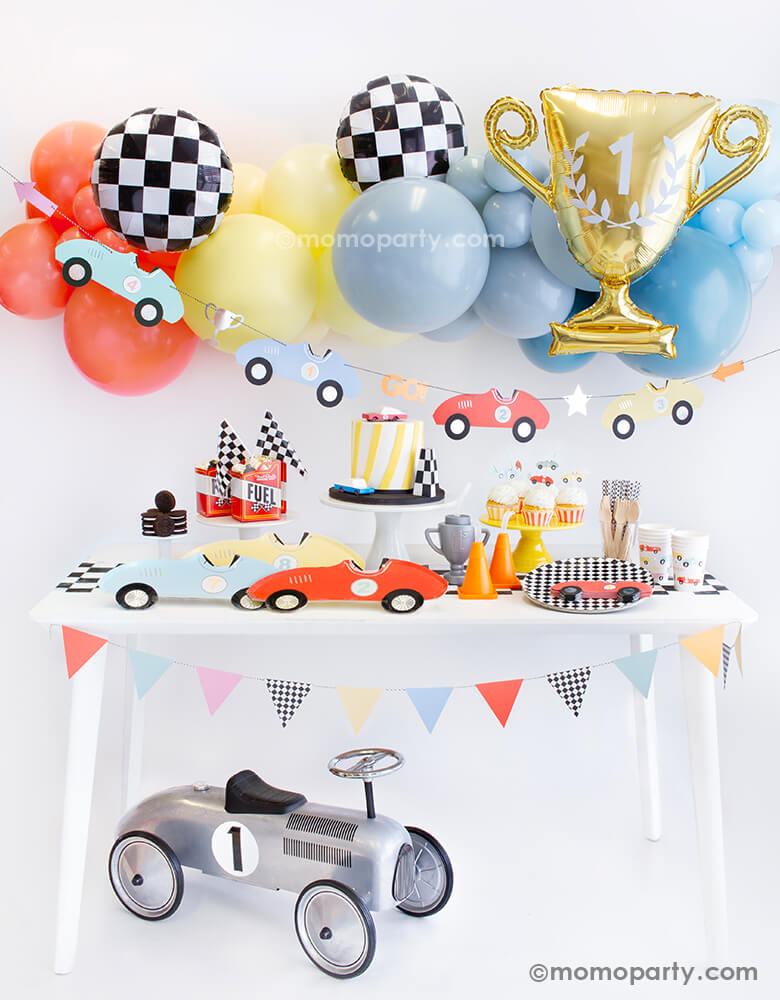 "Fast One" kid's race car themed first birthday party decoration ideas by Momo Party. With vintage race car elements in adorable soft pastel colors including balloons, tableware and decorations, this race car party in the box is perfect for your one-year-old's very first big day!