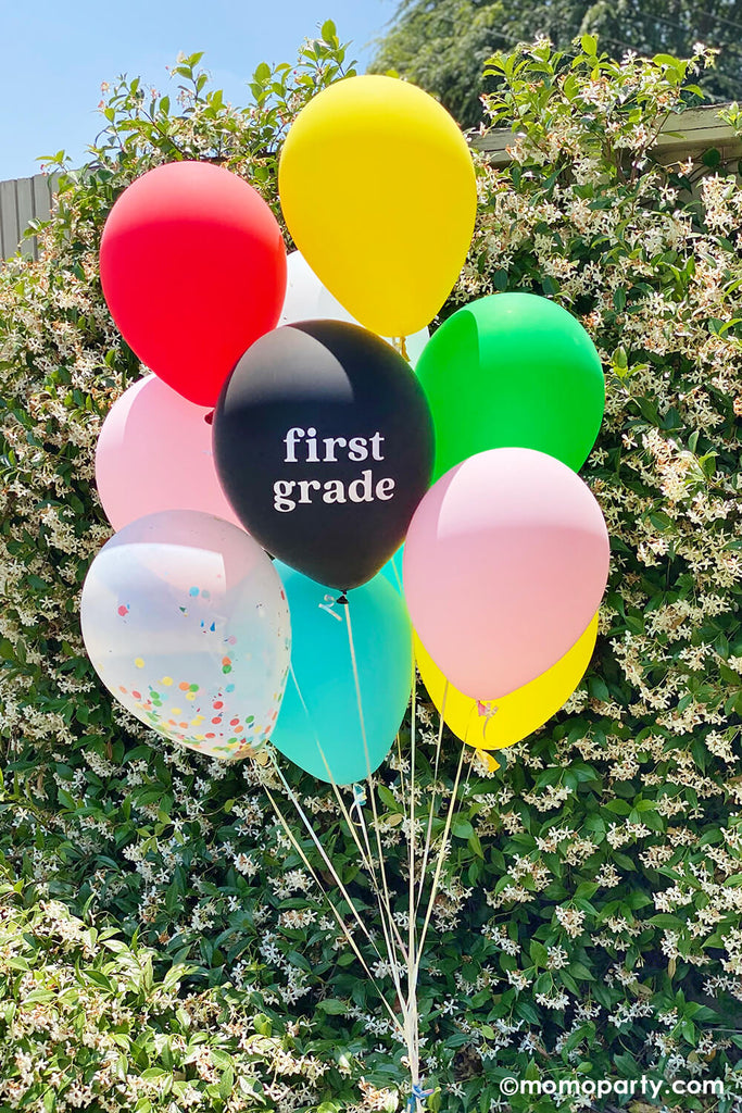 Balloon boutique of Studio Pep Back to school classic balloon mix with black and white first grade latex balloon in the backyard, to celebrate kid's back to school