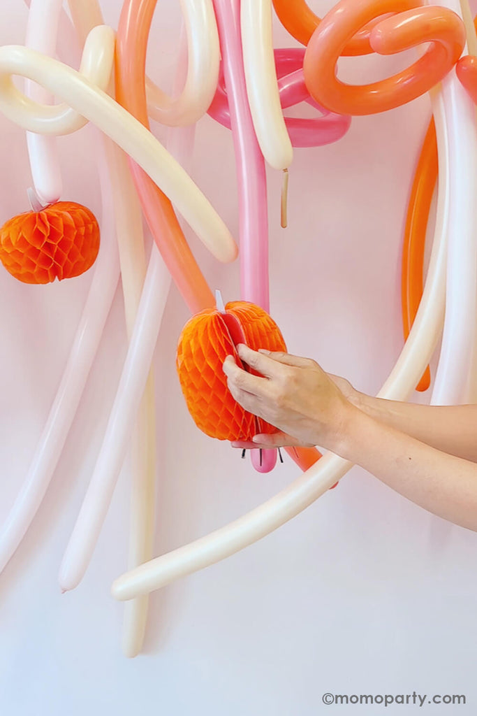 Momo-Party-Balloon-Animal-Backdrop-Instructions_inserting pumpkin honeycombs