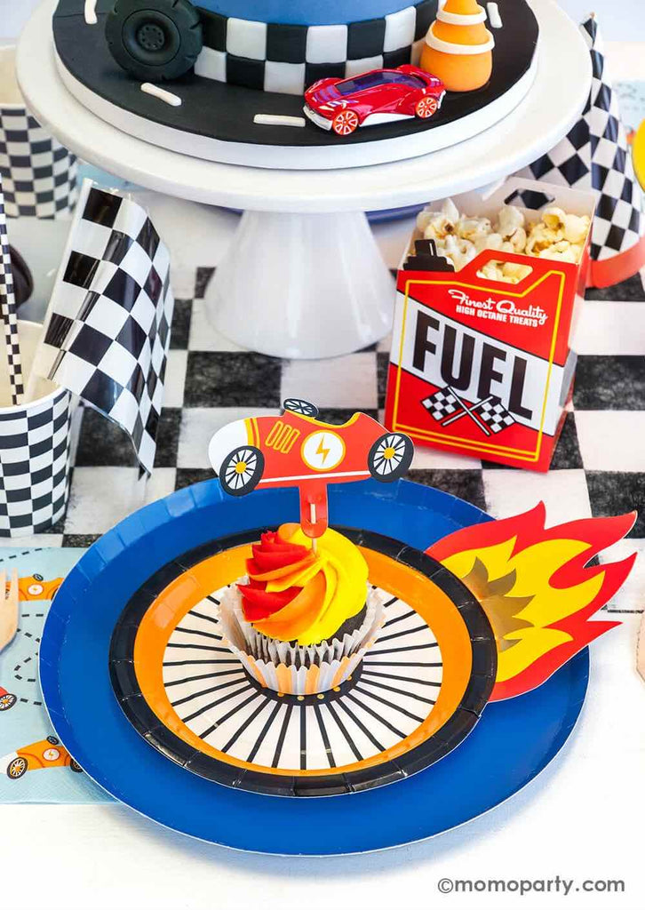 Momo-Party_Hot Wheels-Party_Race Car Tableware featuring the midnight blue dinner plate and the wheel shaped side plate with flames carrying a yellow and orange swirl cupcake topped with race car themed topper - a perfect inspiration for boy's Hot Wheels need four speed birthday party.