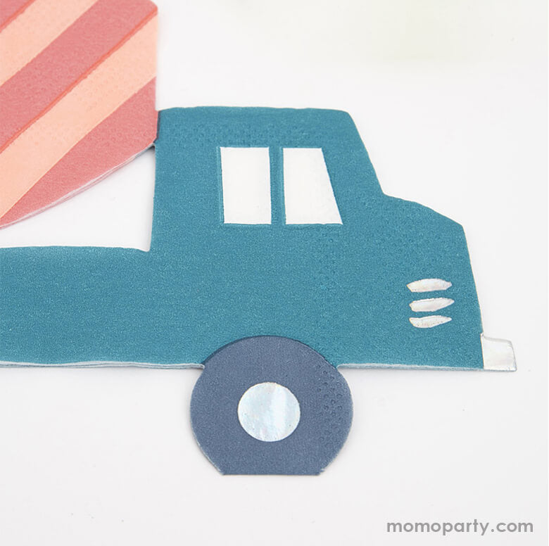Close up details of Meri Meri Construction Napkins. featuring a teal blue color with coral colored Concrete truck die cut shape with lots of silver holographic foil for a special effect.