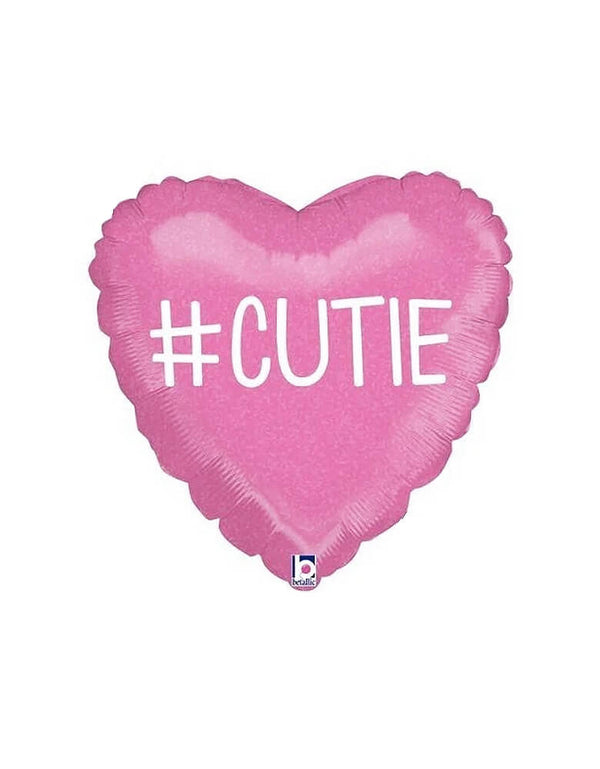 Betallic Balloons - #Cutie Holographic Heart Shaped Foil Balloon. This 18 inches pink heart shaped balloon with Hashtag Cutie text in the middle.  A perfect balloon for your Valentine's Day celebration or girly gathering. 