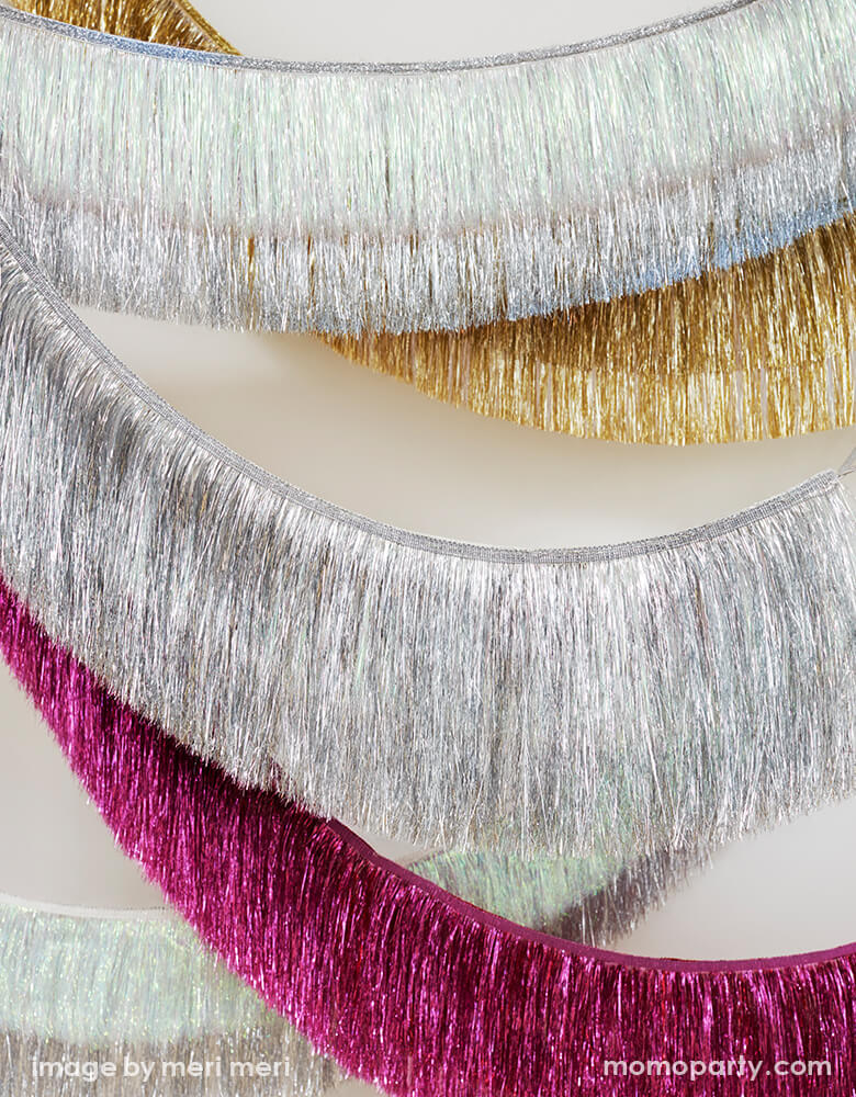 https://cdn.shopify.com/s/files/1/0115/4056/1978/products/Meri-Meri-Holiday-Tinsel-Fringe-Garlands.jpg?v=1644060796&width=780