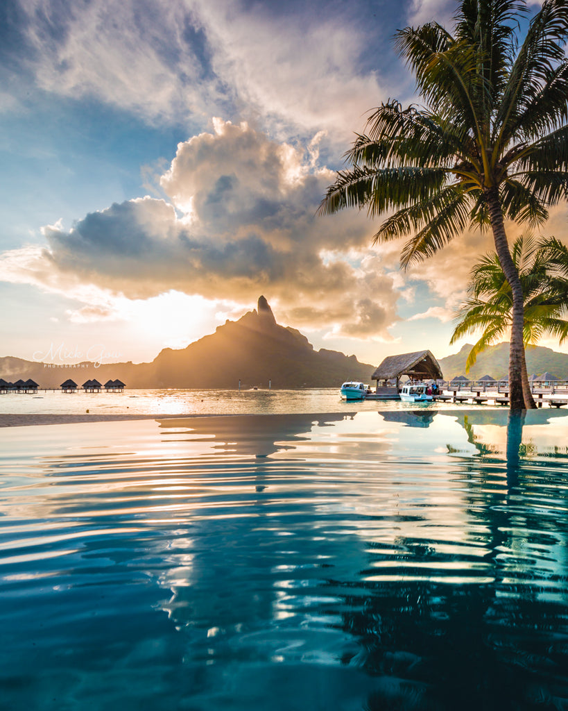 Reflections over a resort pool at Bora Bora