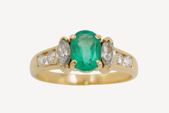 Gold ring with emerald and diamonds