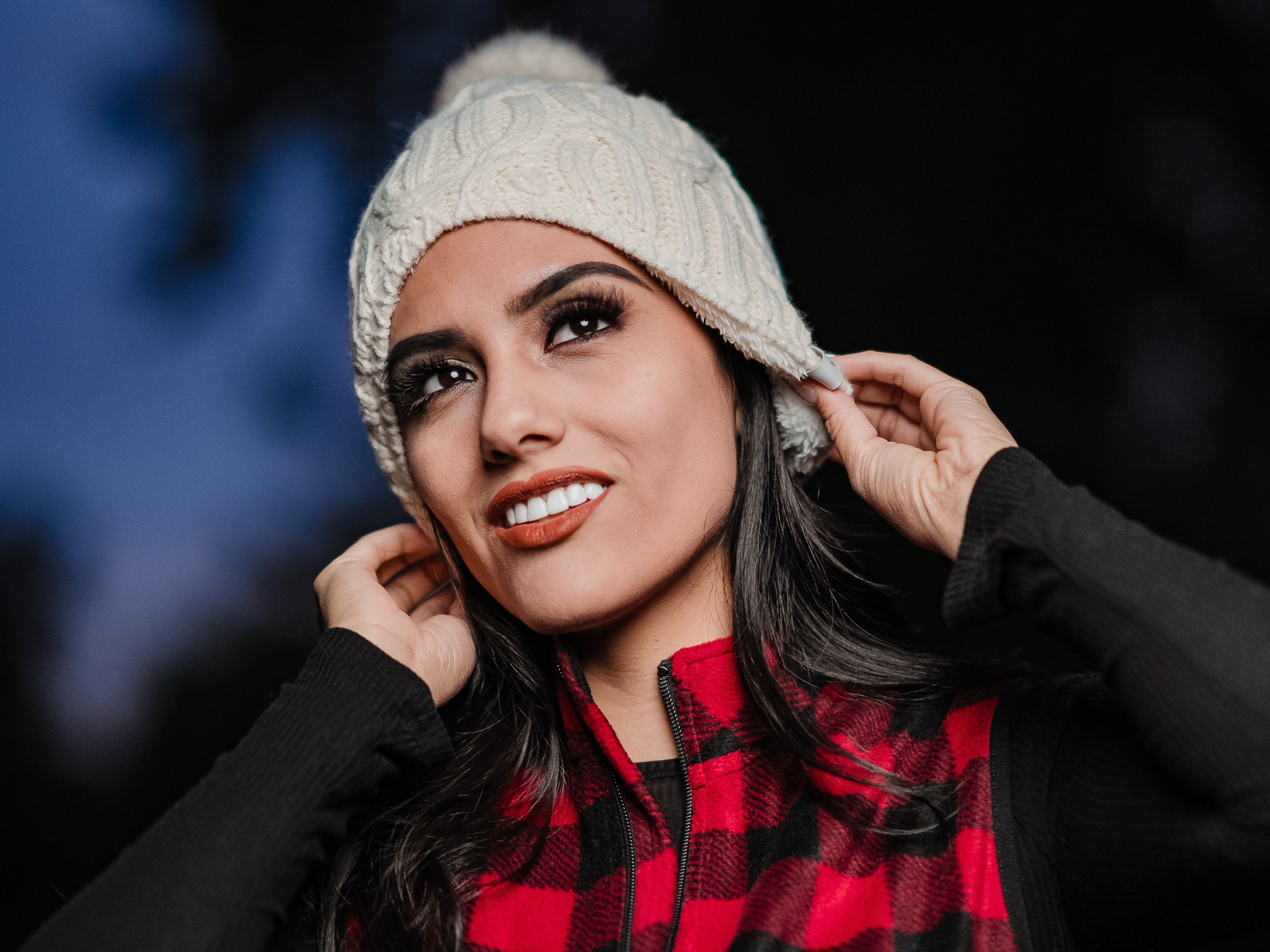 Woman wears thermal beanie from Heat Holders®