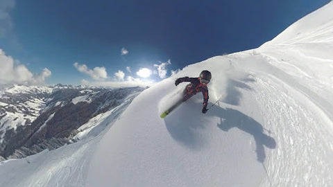 Man skies on virgin snow down steep mountain. | Heat Holders® Thermal