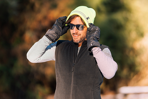 Man pulls on his Worxx® beanie with his Heat Holders® gloves.