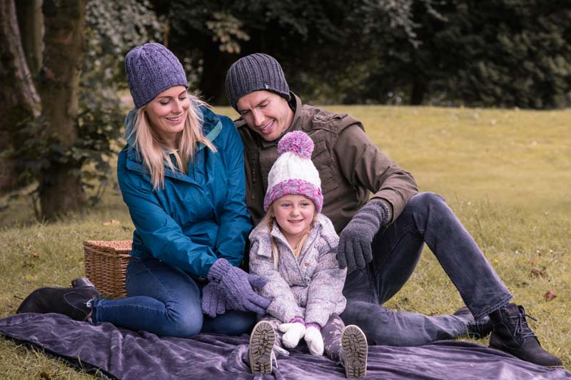 Family wearing Heat Holders thermal hats at a picnic