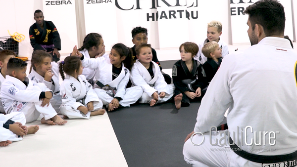 Marcus Buchecha Almeida chatting with young Brazilan Jiu Jitsu Athletes about Cauliflower ear and Cualicure