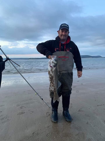 7lb bass caught from the beach at first light. The angler was using MOONGLOW 8mm lumi green attractors 