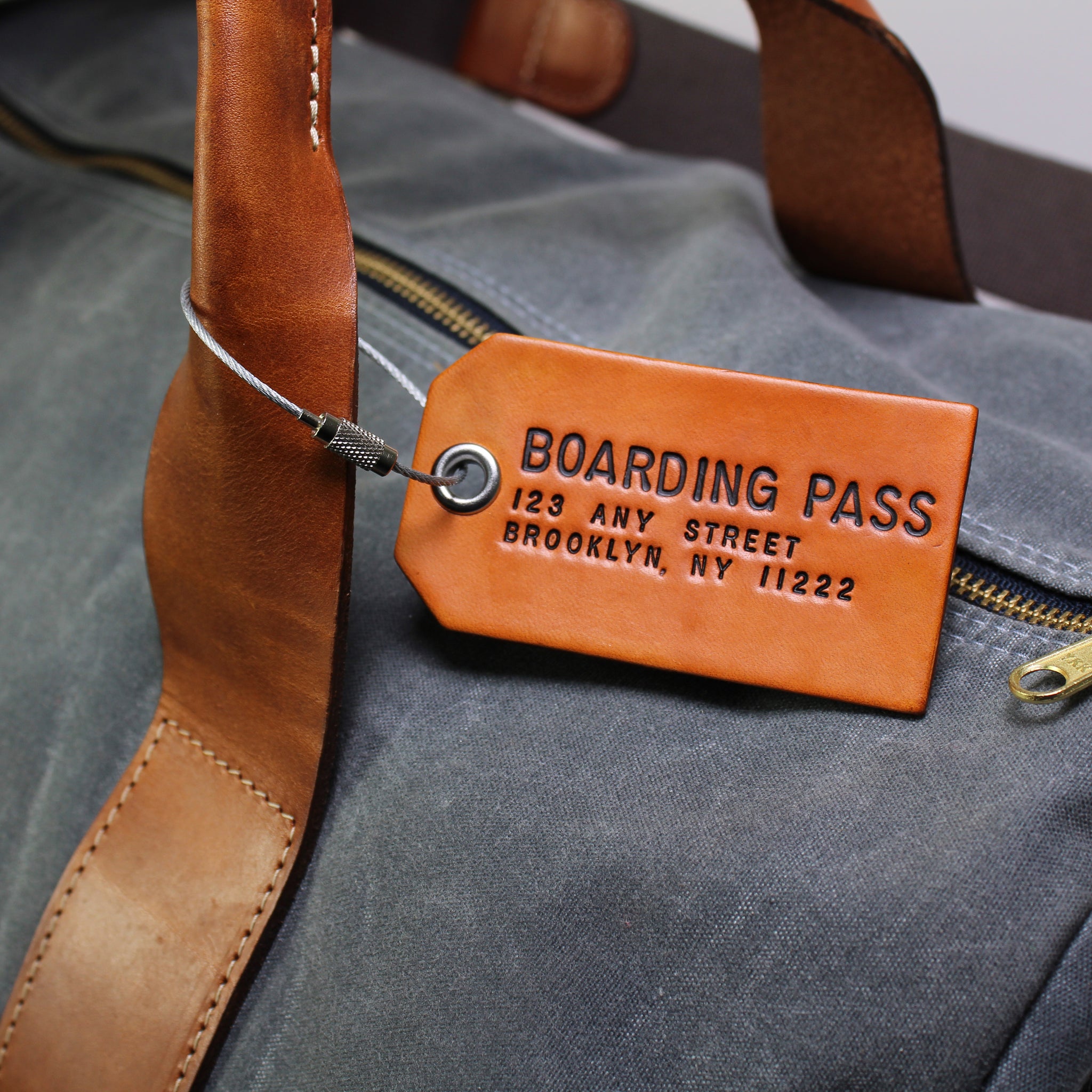 a-pair-of-custom-brown-leather-luggage-tags-boarding-pass-nyc